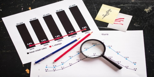 A magnifying glass and graph paper AI-generated content may be incorrect.